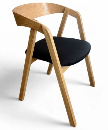 Scandinavian oak dining chair with ergonomic bentwood backrest.