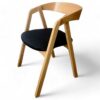 Scandinavian oak dining chair with ergonomic bentwood backrest.