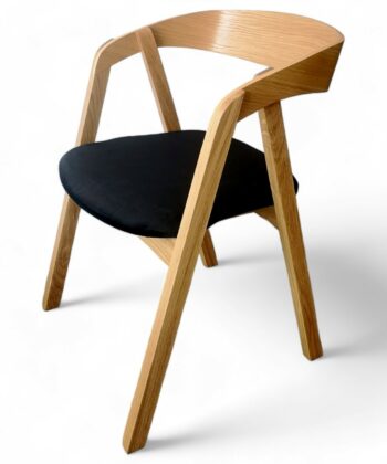 Scandinavian oak dining chair with ergonomic bentwood backrest.