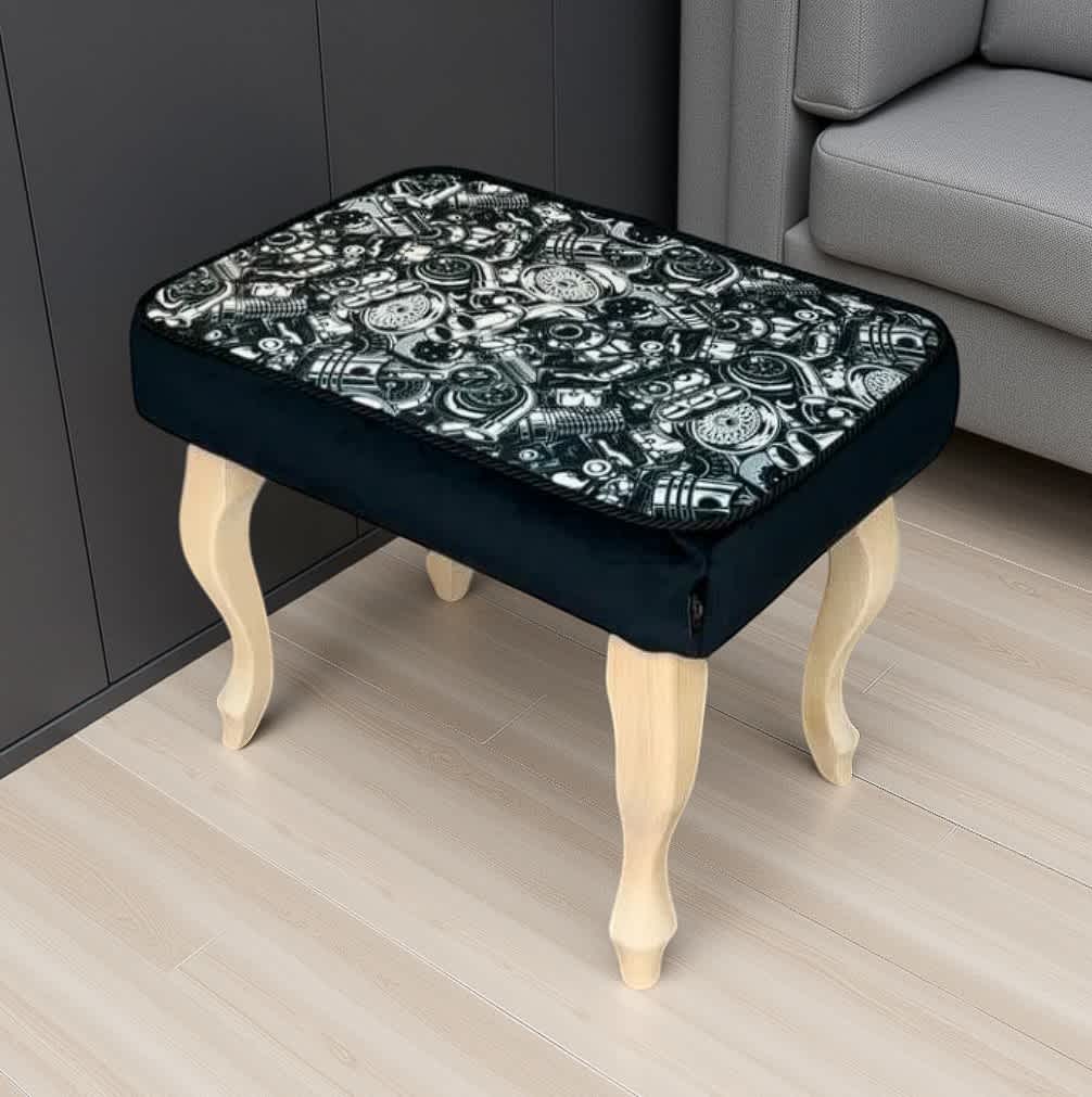 Handcrafted velvet footstool with elegant wooden legs and a unique patterned cushion for stylish home comfort