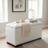 Elegance Bouclé Ottoman with Storage, tufted design, white bouclé fabric, stylish home décor, modern interior setting, accompanied by decorative tray and books.