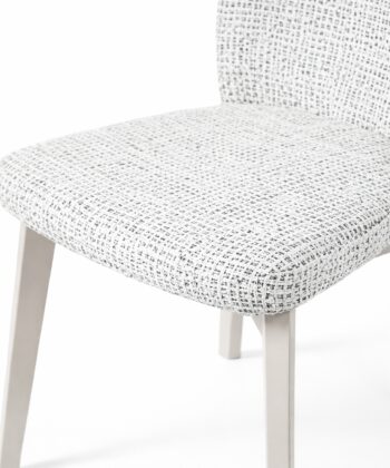 Soft textured white pouffe chair with wooden legs, perfect for modern living spaces.