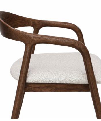 Elegant wooden armchair with a cushioned seat, perfect for modern living spaces.