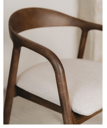 Elegant wooden armchair with beige upholstered seat for modern home decor.