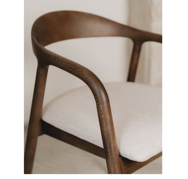 Elegant wooden armchair with beige upholstered seat for modern home decor.