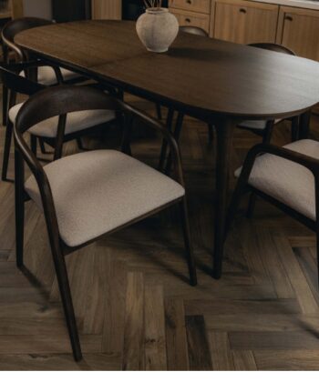 Elegant wooden dining table with upholstered chairs, perfect for modern kitchens and dining rooms.