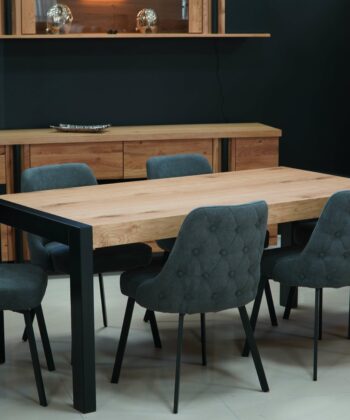 Modern dining room with wooden table and six upholstered chairs in a stylish setting.