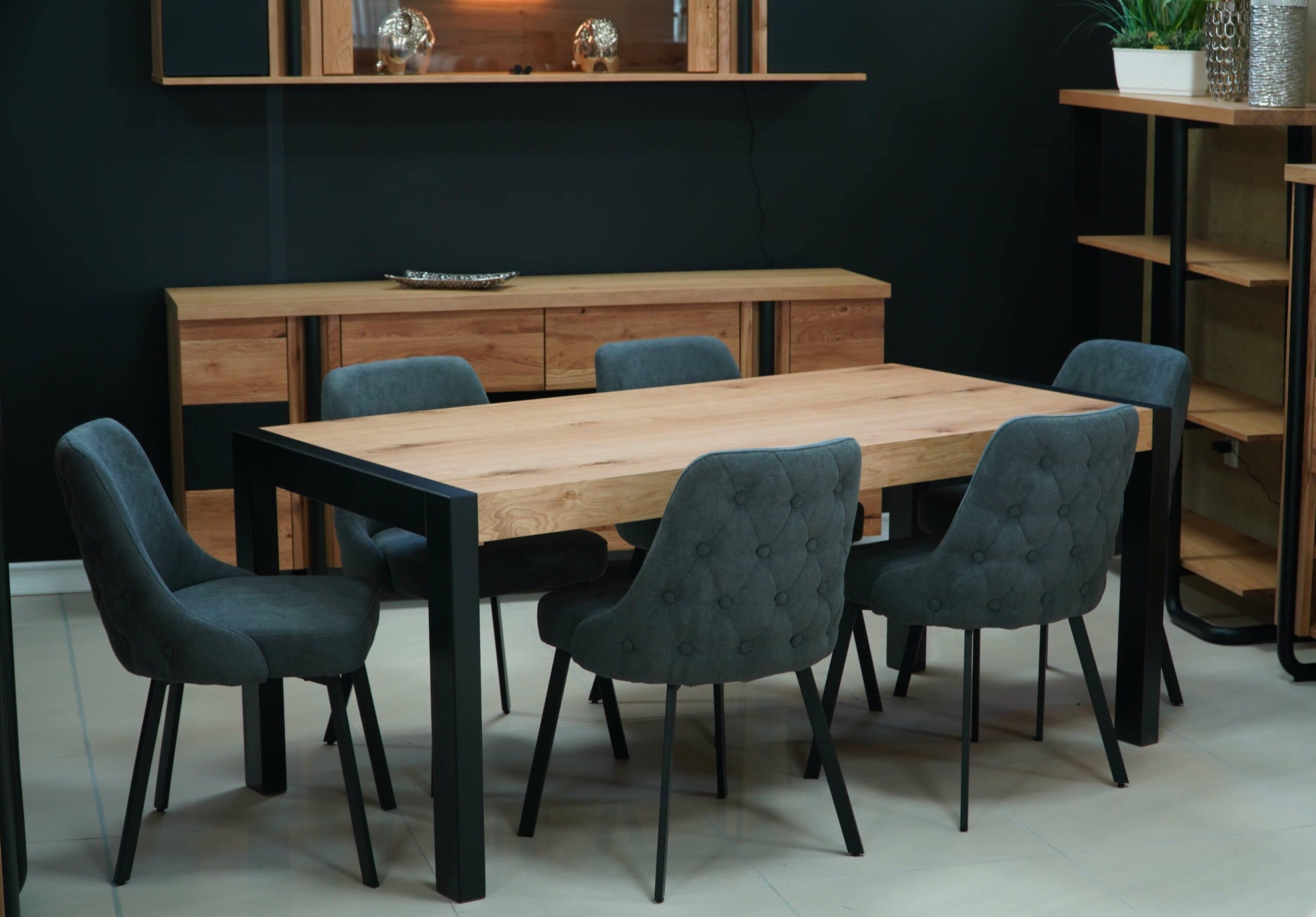 Modern dining room with wooden table and six upholstered chairs in a stylish setting.