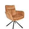 Armchair with soft, plush tan upholstery and black metal tripod base.