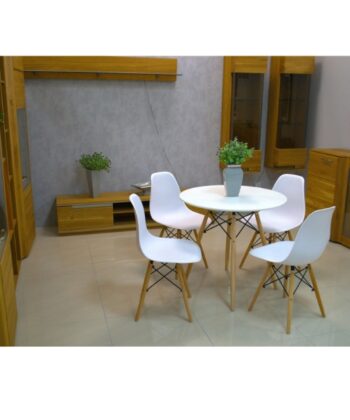 Modern dining room with white chairs and wooden furniture, minimalist decor, and potted plants.