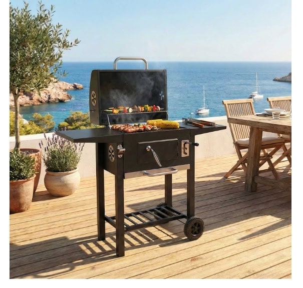 Outdoor barbecue grill on a wooden deck with sea view and patio furniture.