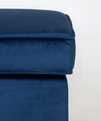 Soft navy blue pouffe with plush fabric, ideal for modern living room decor.