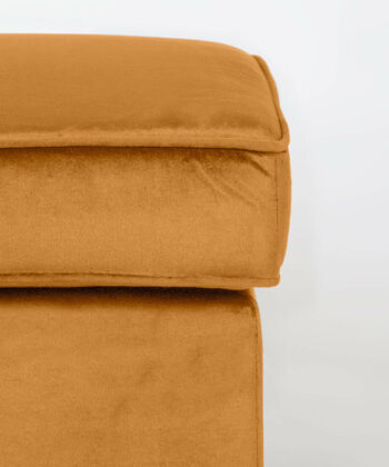 Soft orange pouffe with plush fabric, perfect for modern living rooms. Stylish and comfortable seati.