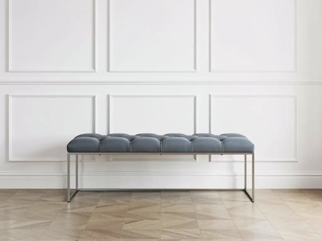 Measuring tape laid across a bench frame showing length, depth and seat height